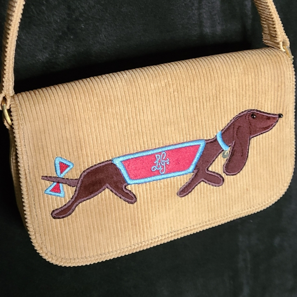 A corduroy Lulu Guinness dachshund design purse